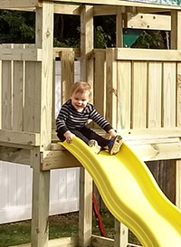 On the family's new swingset (October 2017)